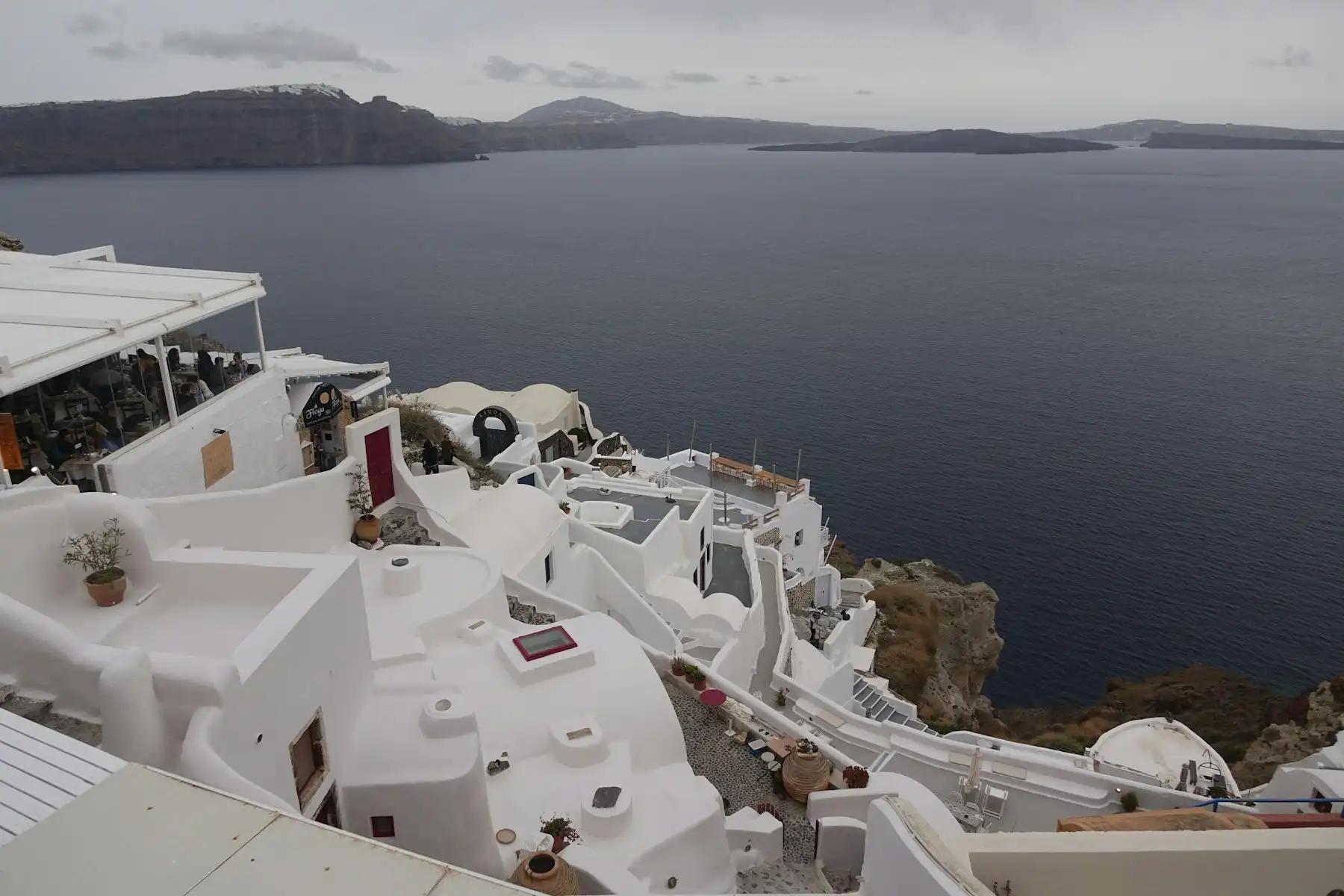 Whitewashed rooftops looking across the caldera strait toward Therasia island
